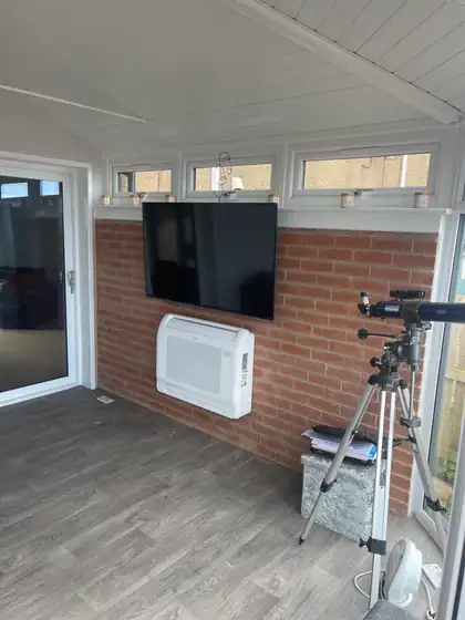 Floor-standing console air conditioner in a garden room