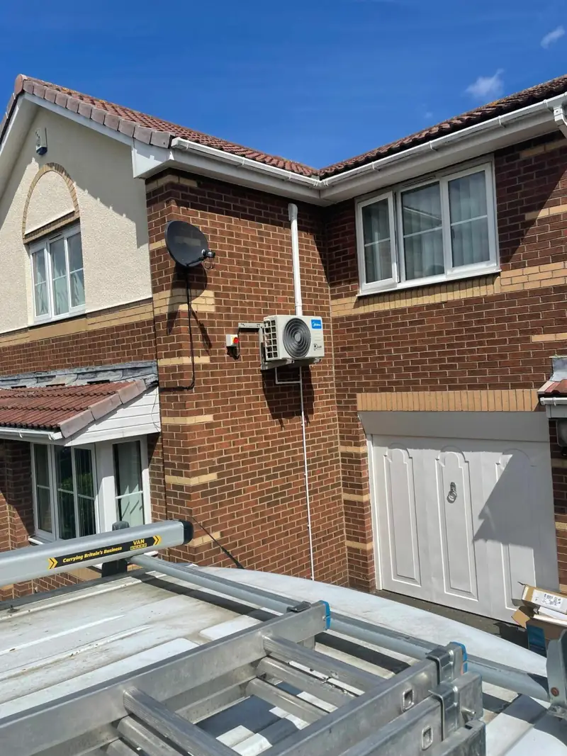 Air conditioning outdoor unit installed on a Manchester family home