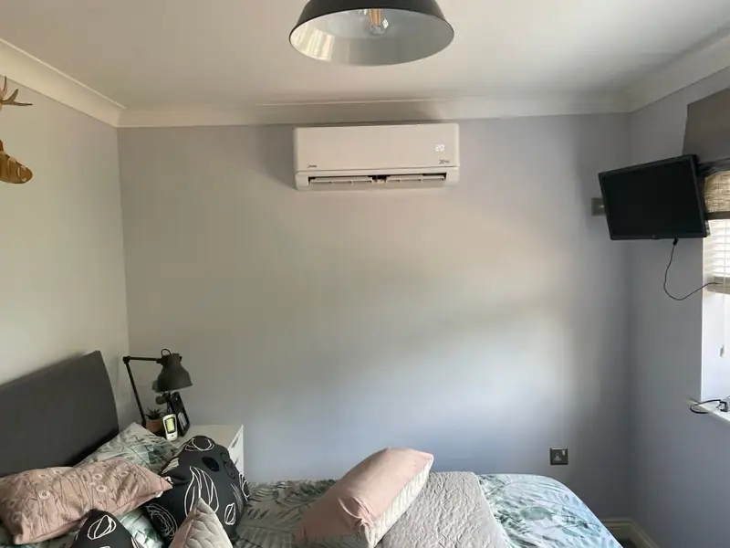 Living room split air conditioner set to an energy-efficient temperature